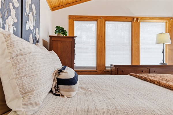 Wake up in comfort or unwind under the stars in the primary bedroom’s king bed and private porch.