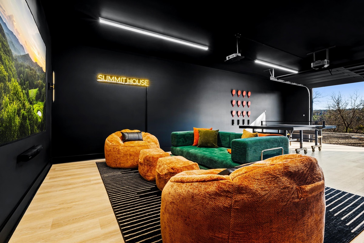 {Theater + Lounge} Open the garage door, pour a drink, and settle in — ping pong matches, music playing, conversations that turn into late-night memories.