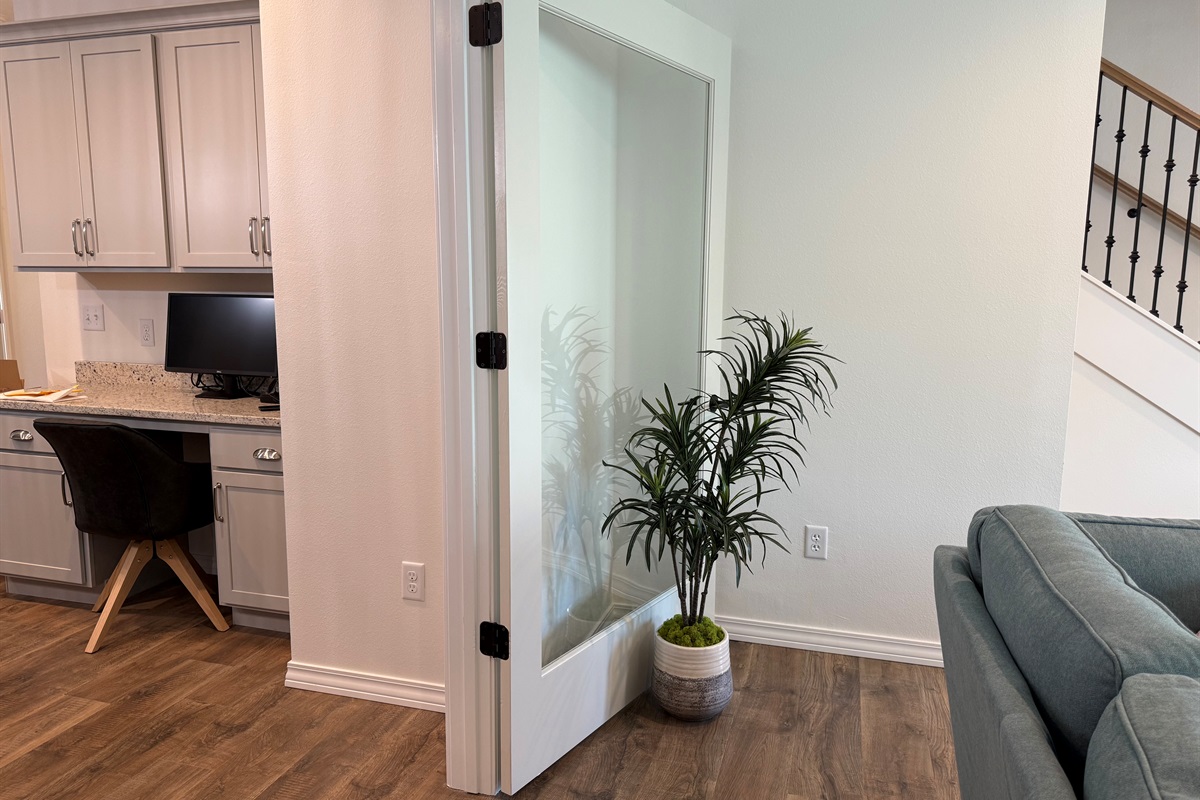 Large potted plants to hold glass doors open and add that home feel to the Living room