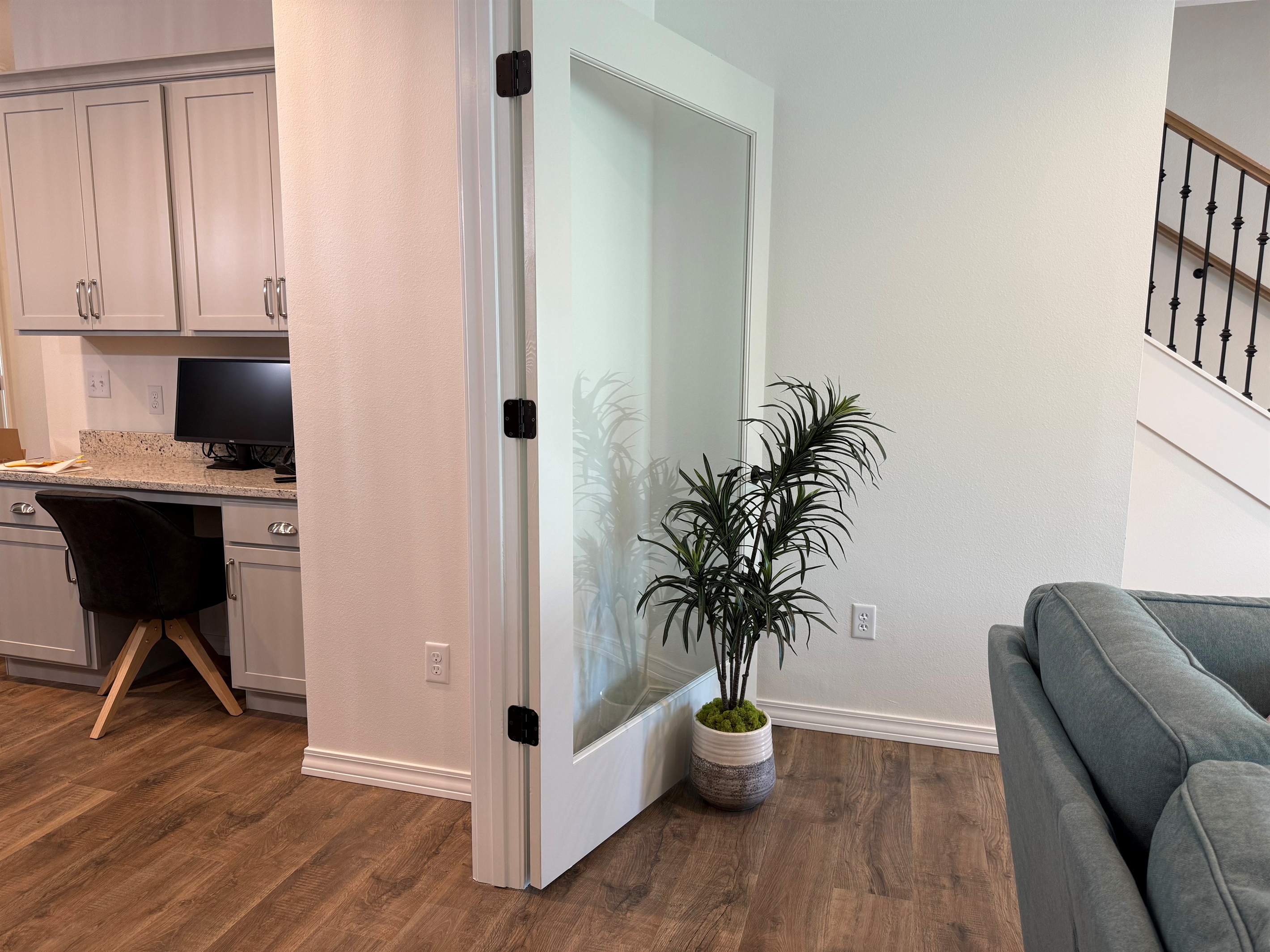 Large potted plants to hold glass doors open and add that home feel to the Living room