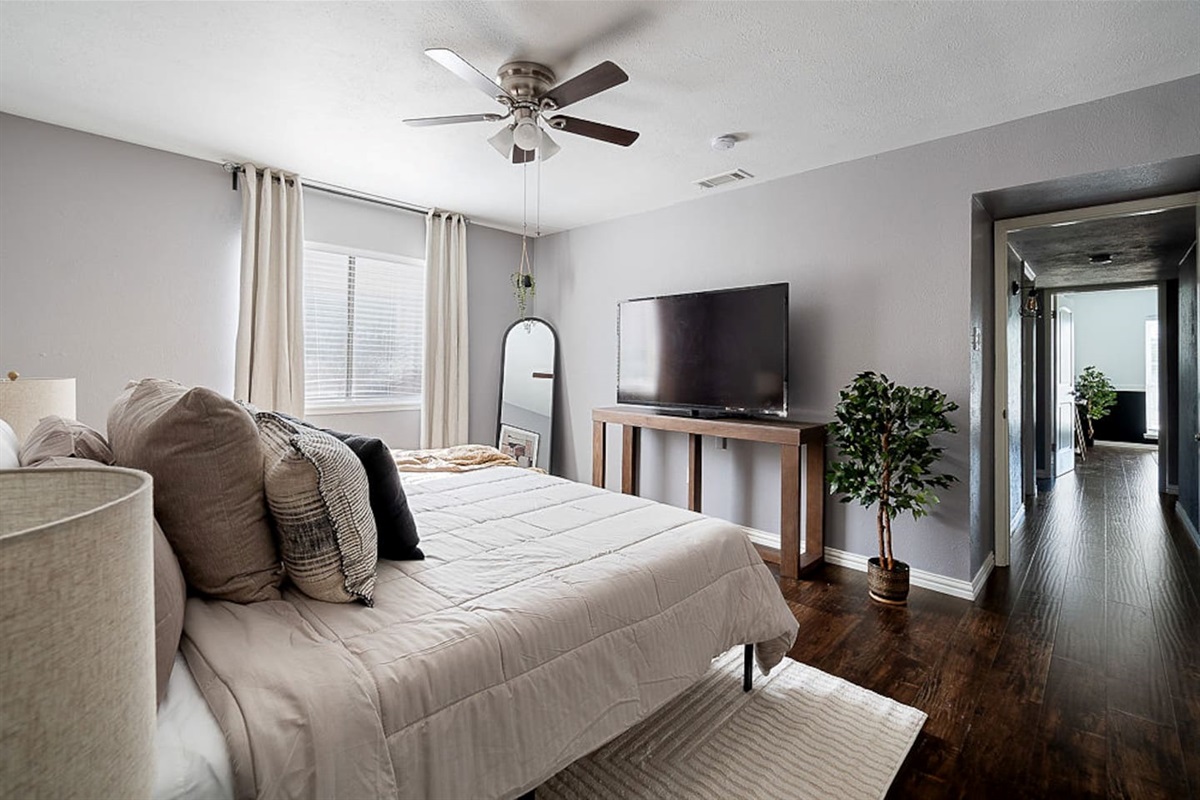 Find refreshment in the master bedroom with a king-sized bed and a private, attached bathroom for your ultimate comfort