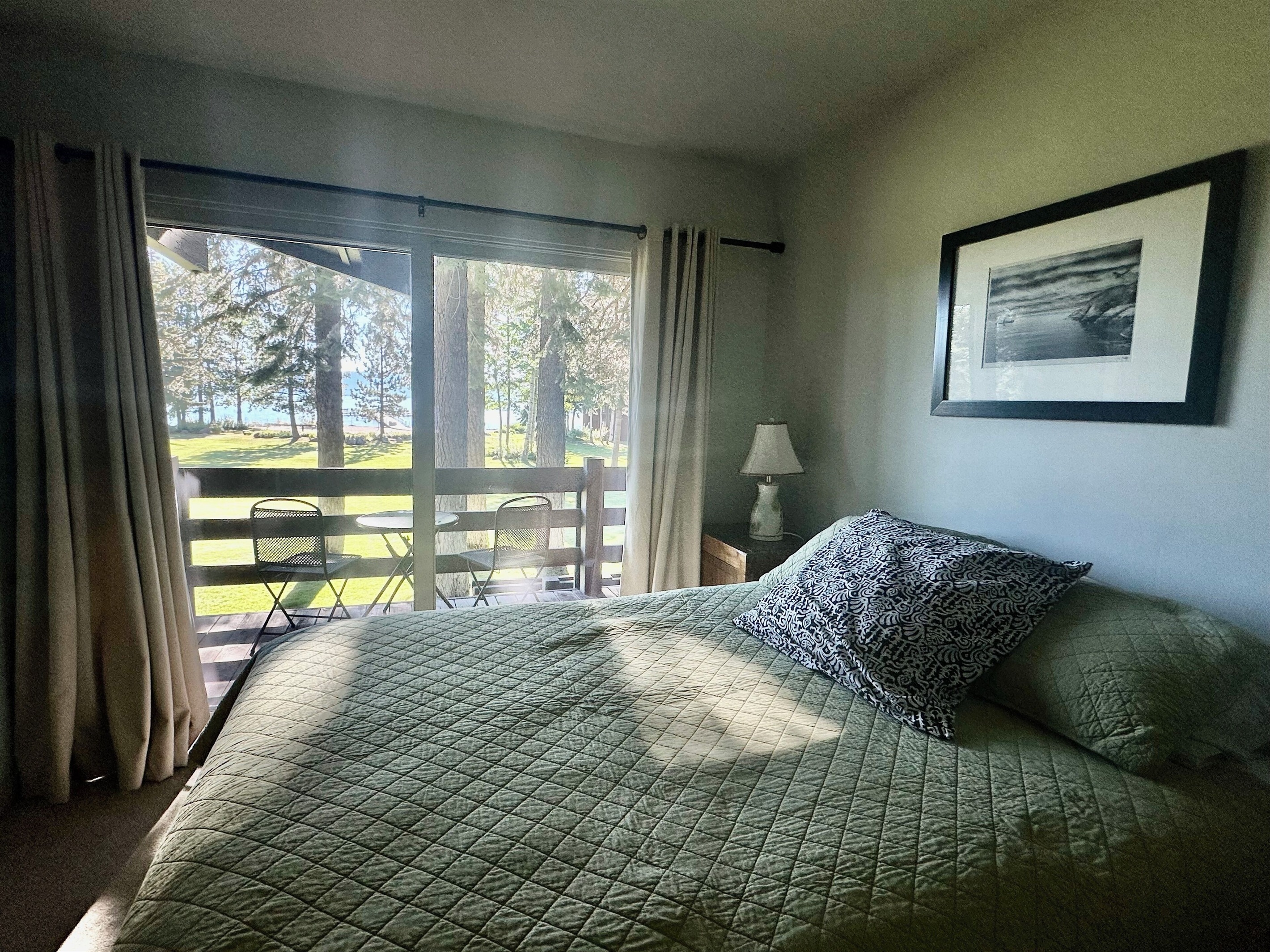 Another guest room with queen bed also has access to lake facing balcony
