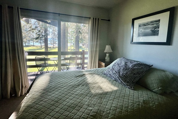 Another guest room with queen bed also has access to lake facing balcony