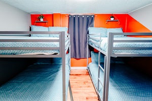 Bunk Bed Getaway: Twin Double Bunks in Chic Teal Beds with Sleek Gray Frames. Enjoy Entertainment with TV and Study Time at the Table and Chair Set 🛏️📺📚