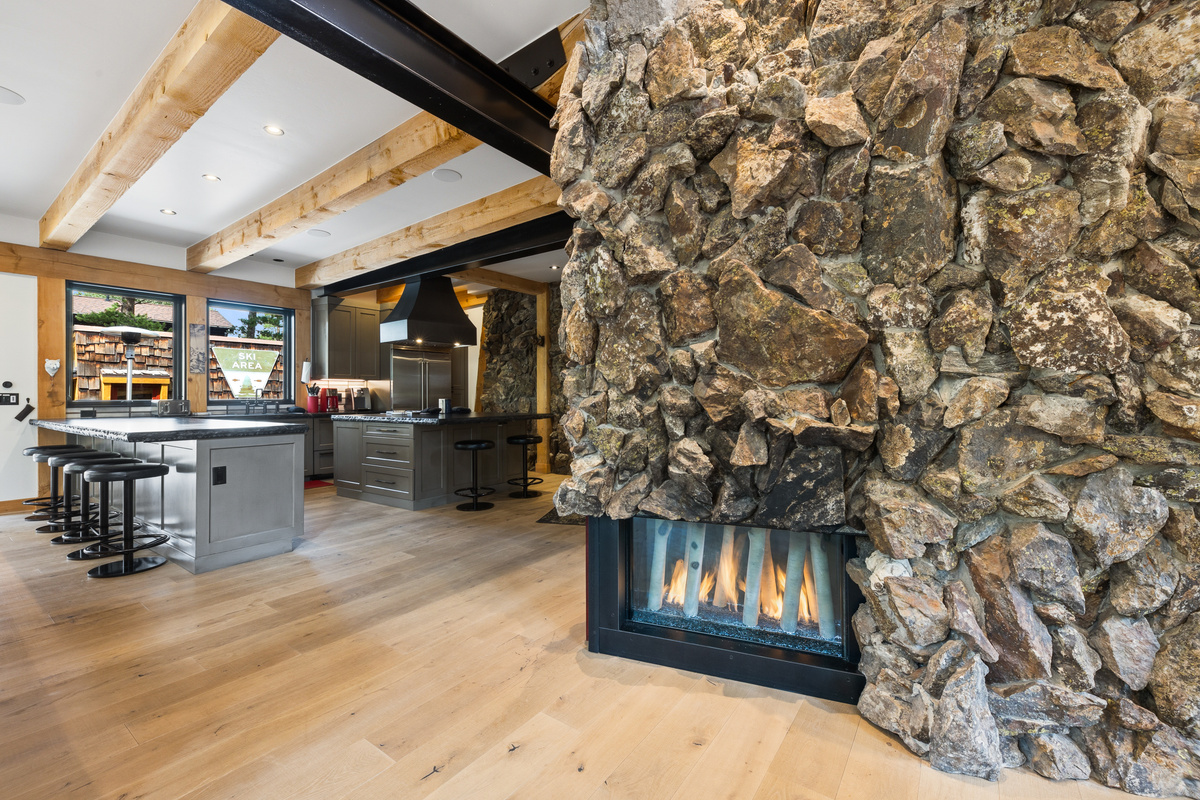 This unique gas fireplace in the center of the home has LED multi-colored lighting for a variety in ambience. Set it to your preference depending on mood and time of day.