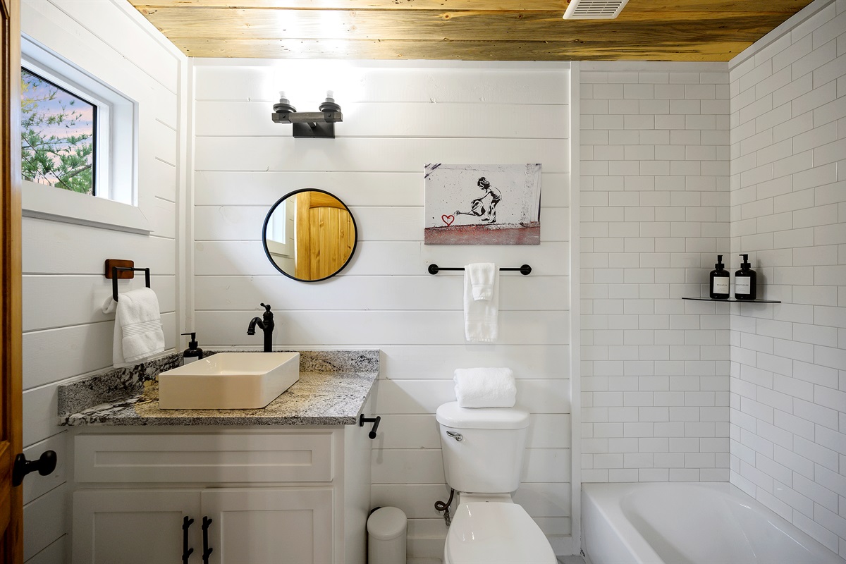 Bunk room bathroom convenience that keeps the fun upstairs easy and stress free. 
Bright, modern, and just steps from the bunk loft so everyone can rinse off and recharge between adventures.