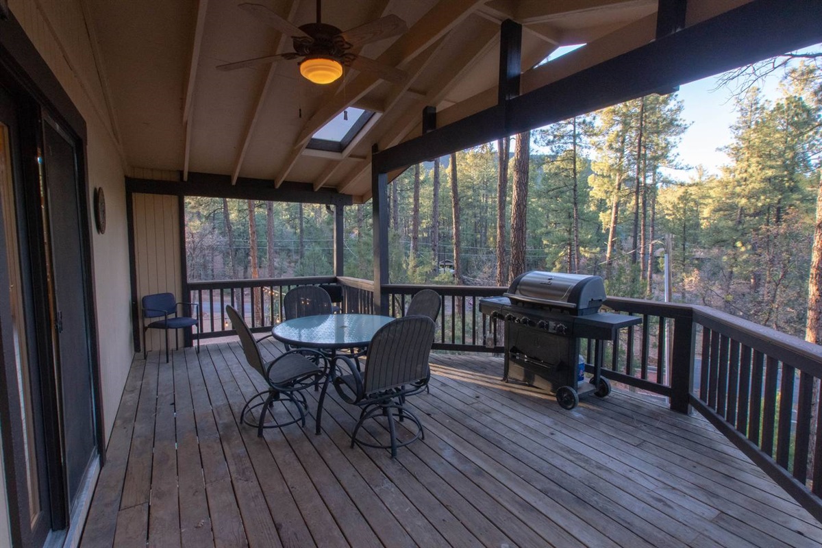 Deck #2 of 3 with seating and gas grill.