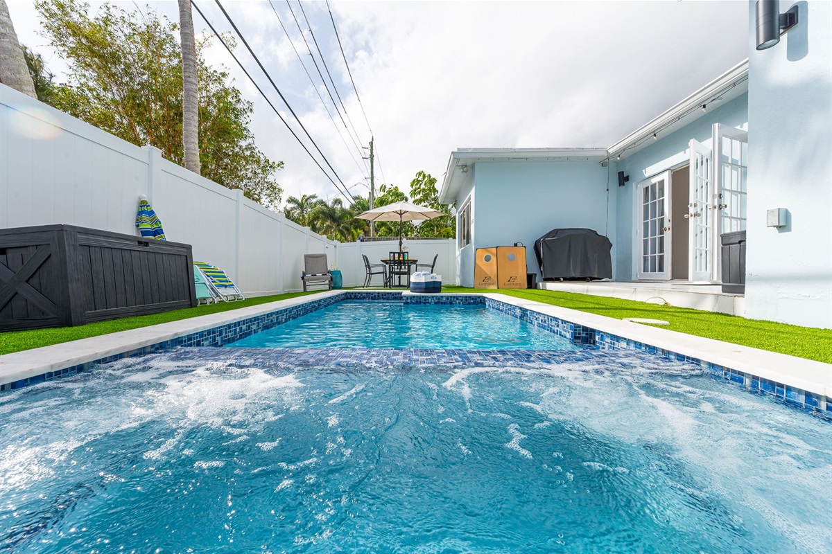 Enjoy your own private pool and hot tub, gas fire pit lounge, outdoor dining, and games—ideal for families and groups seeking a fun Florida escape.