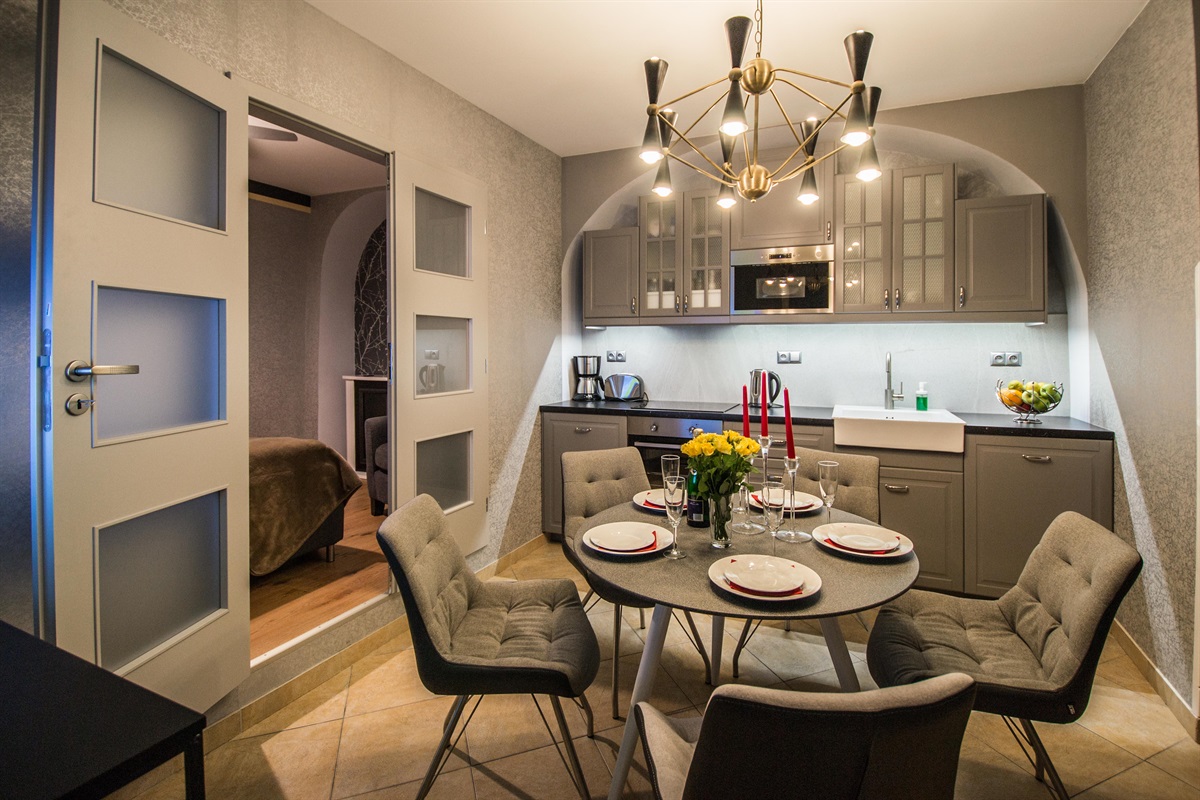 Kitchen with dining area. Kitchen is fully equipped with everything you might need for long or short visit in Prague!