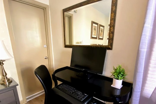 Desk with 24' Monitor and keyboard provided