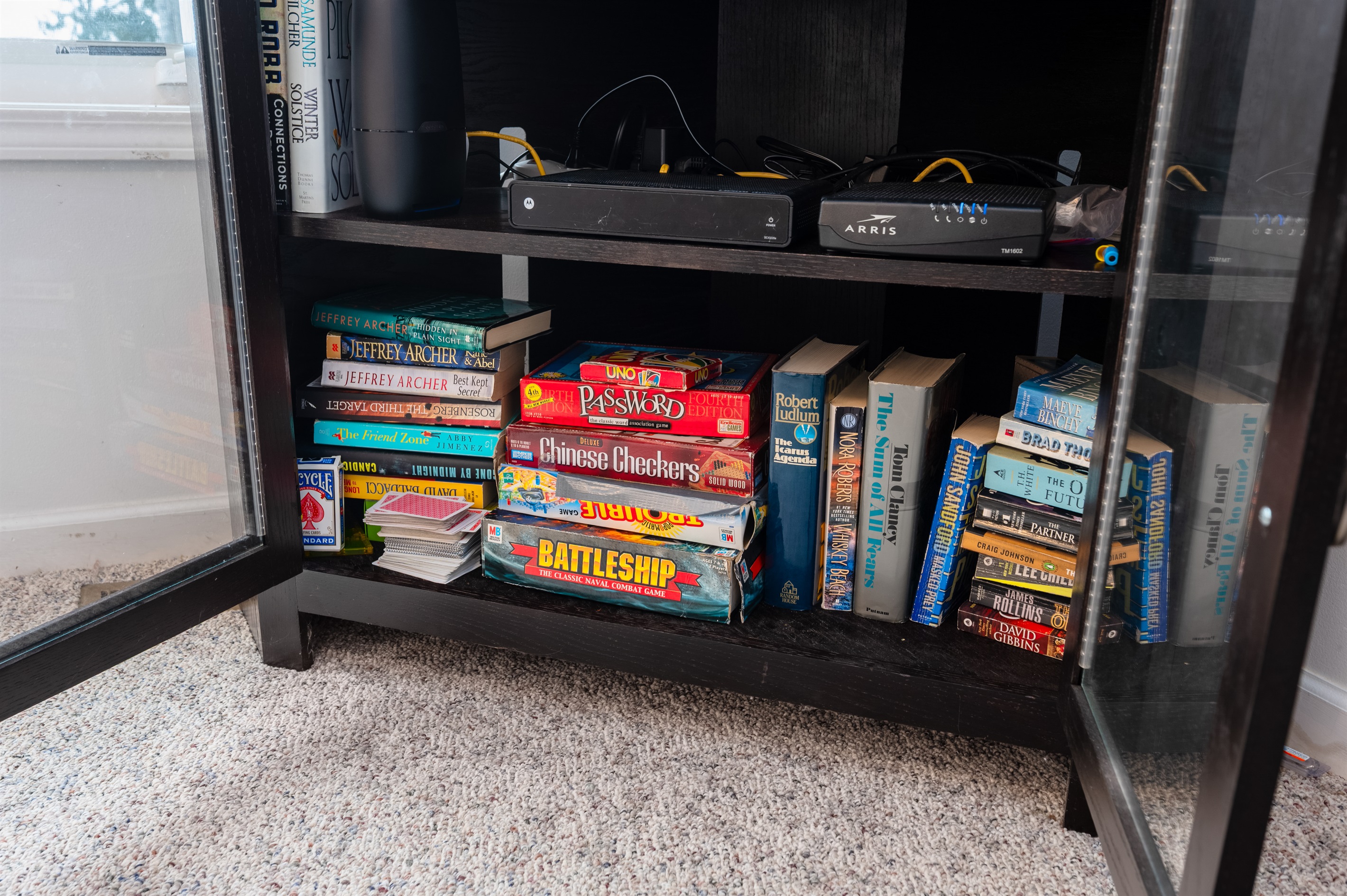 Game shelf stocked with board games