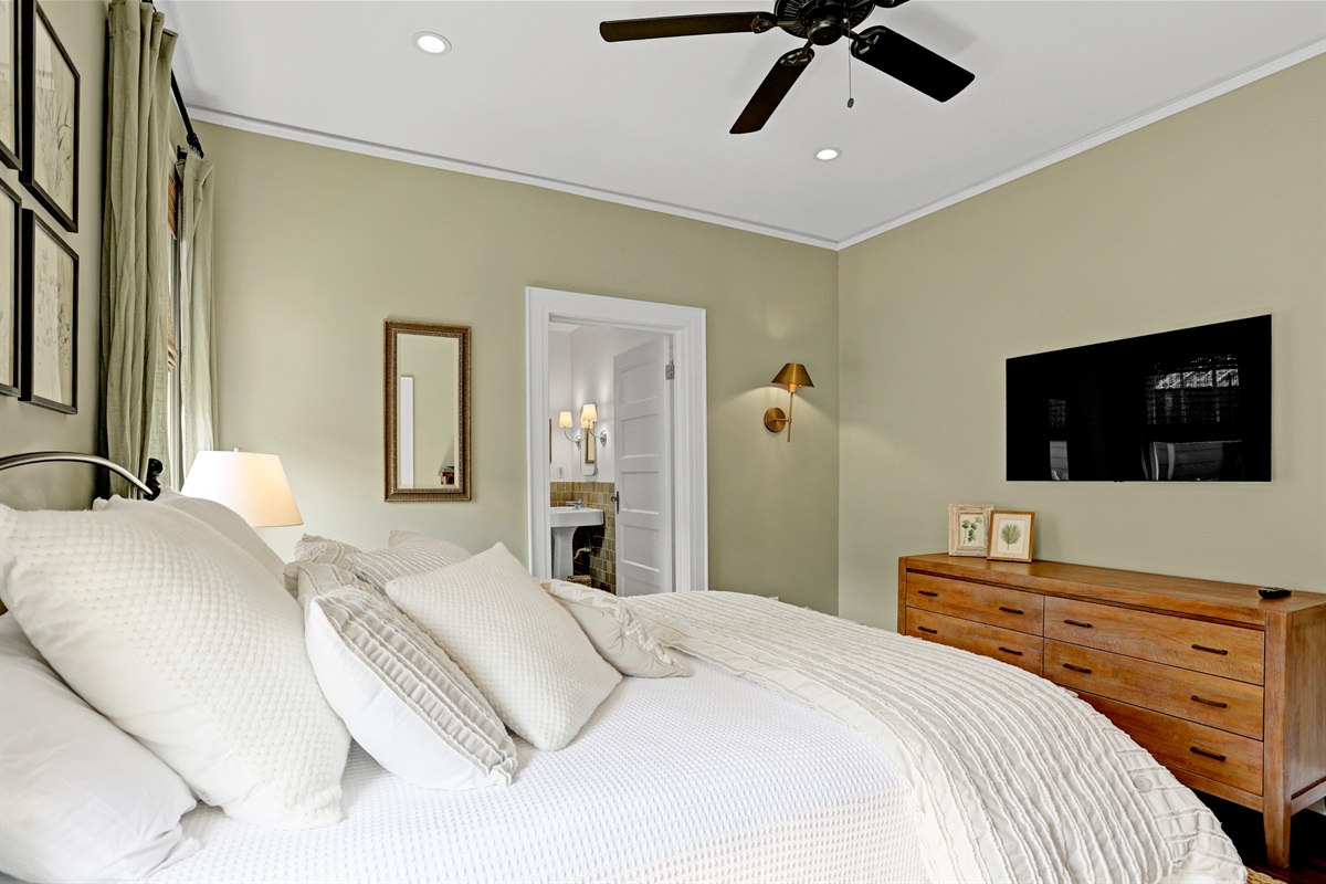 Soft sage walls create a peaceful backdrop ideal for rest and relaxation.