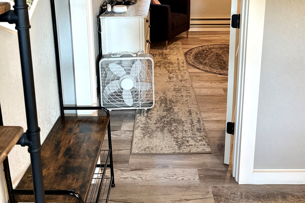 Hall to second bedroom with a door.