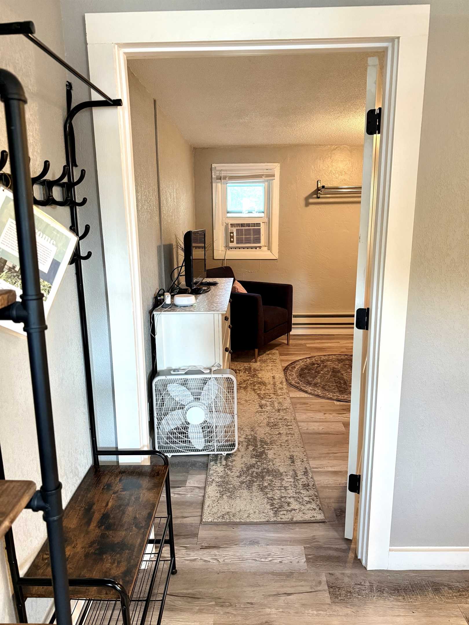 Hall to second bedroom with a door.