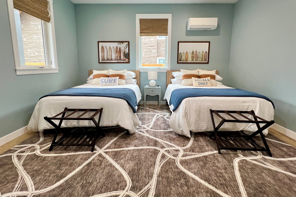34 Villa B downstairs two-queen bedroom — flexible for families or adult groups.