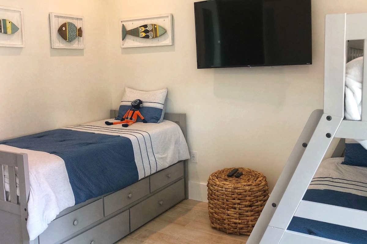 Full Bed and 3 Singles, With Attached Bath With Tub/Shower Combination and T.V. 