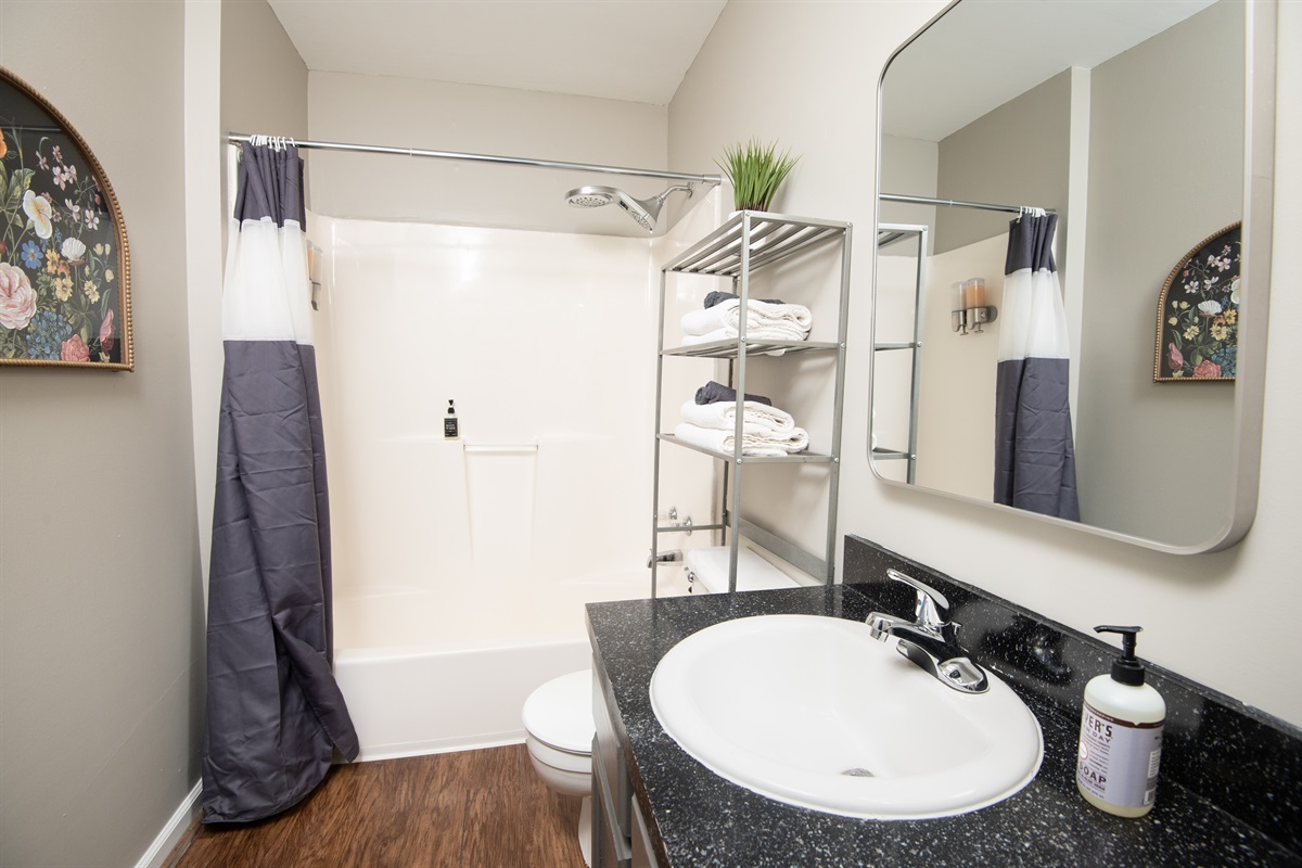 Unit F has a hallway bathroom completely stocked with towels, soaps, and anything else you might need!