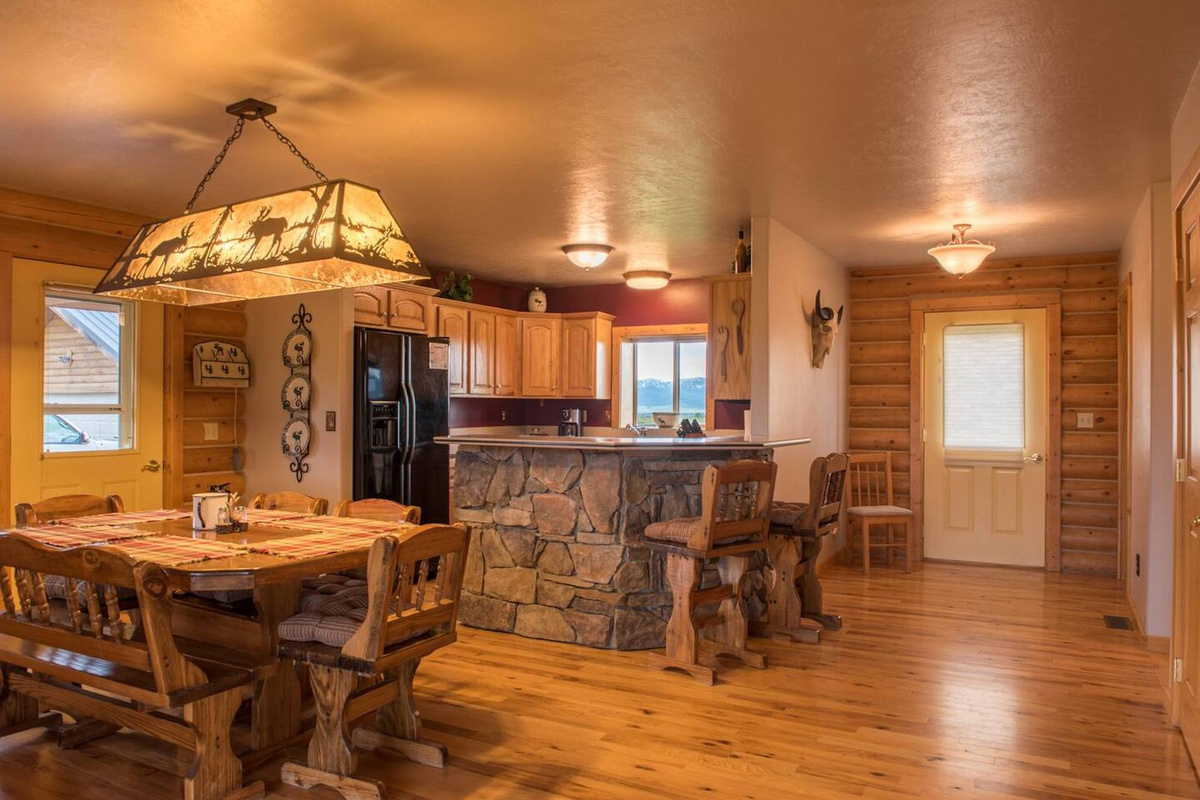 The open kitchen allows for plenty of room to cook, enjoy meals, play board games, or plan your outdoor adventures.