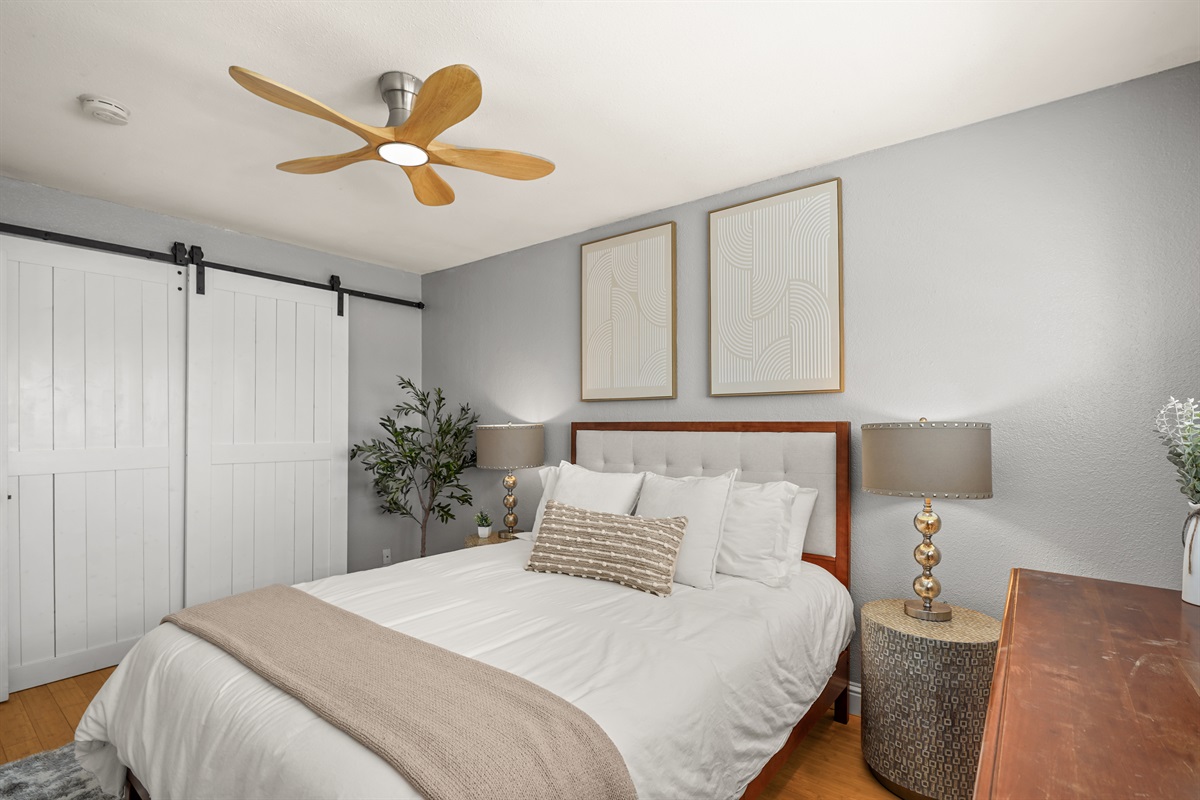 Cozy upstairs bedroom with a queen bed and relaxing atmosphere.