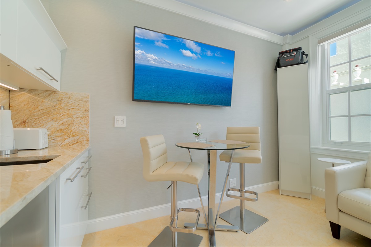 Table for 2 or to work on your lap top.  Bright skies w/electric window shades.