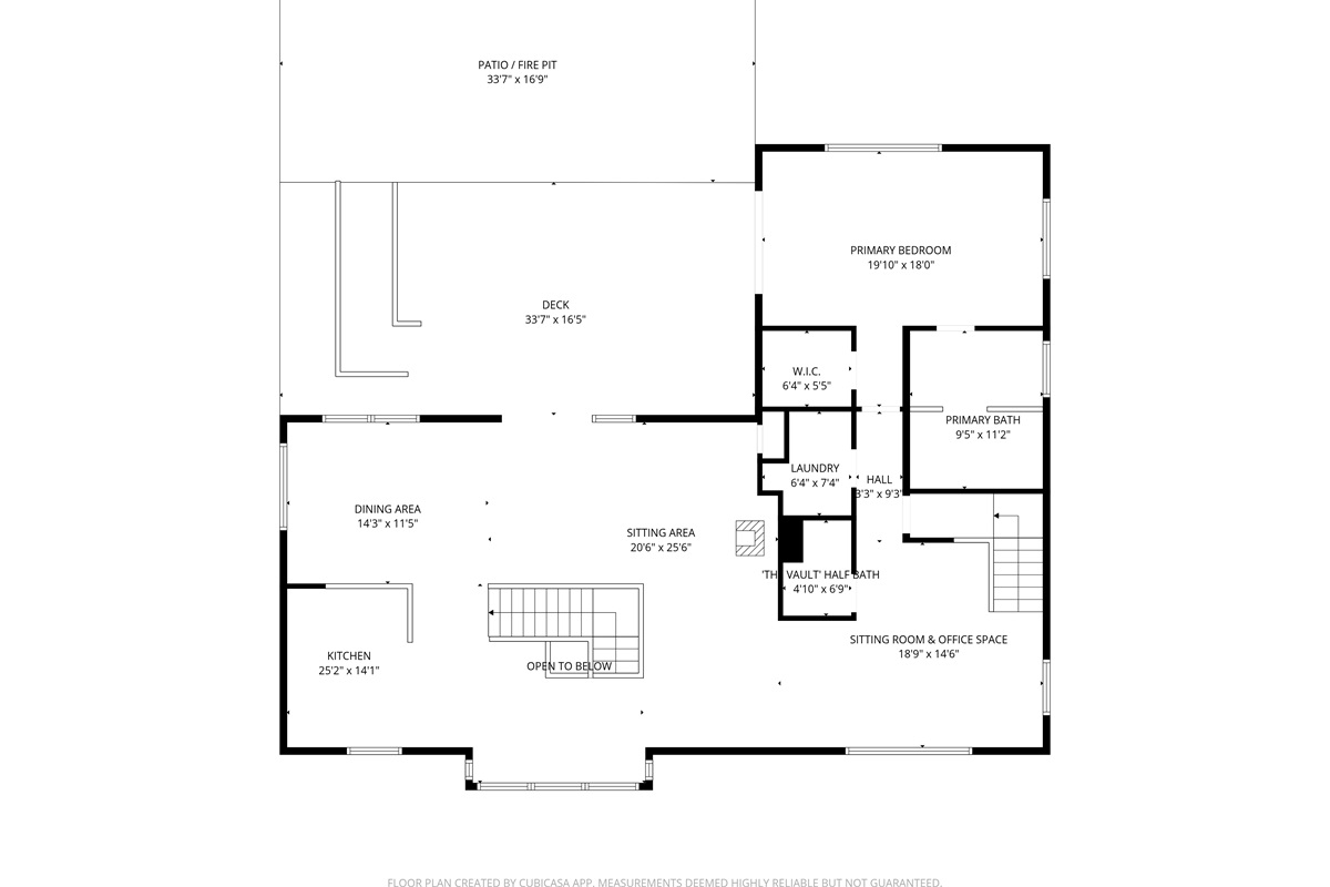 The main floor social heart. Open-concept gourmet kitchen, dining, and living areas flow out to the massive 33ft deck and stone fire pit. Includes the primary king suite wing, laundry, and the "Instagrammable" designer half-bath for group convenience.