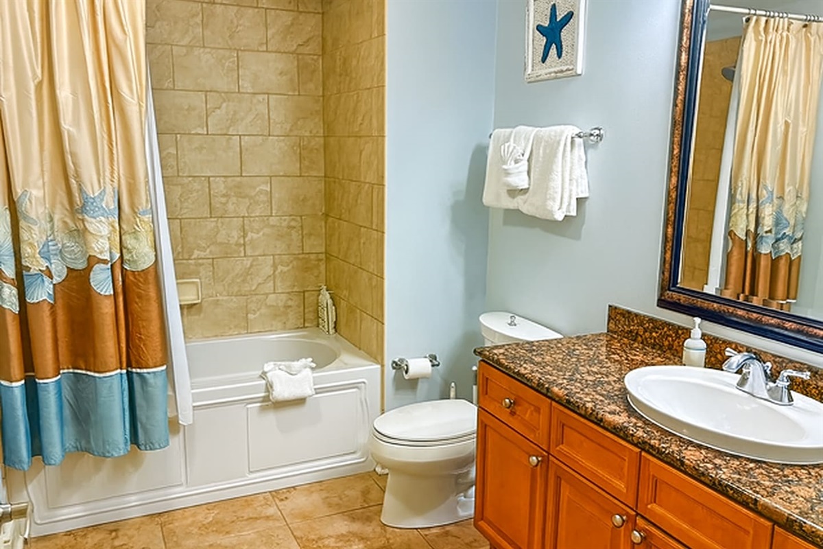 A bright, well-kept guest bathroom with everything your family needs for a comfortable stay.