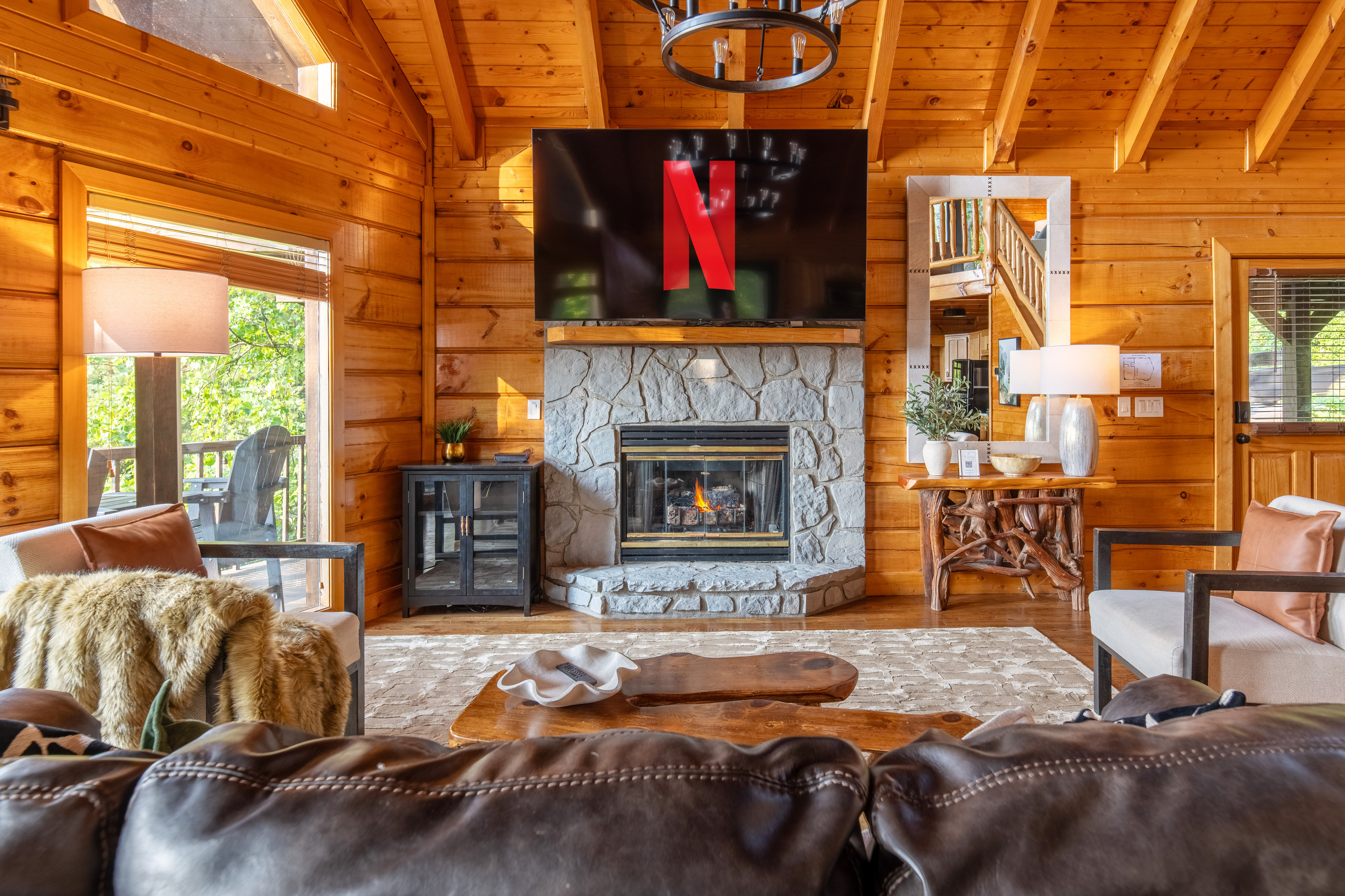 Relax and enjoy the large 85" TV and cozy fireplace