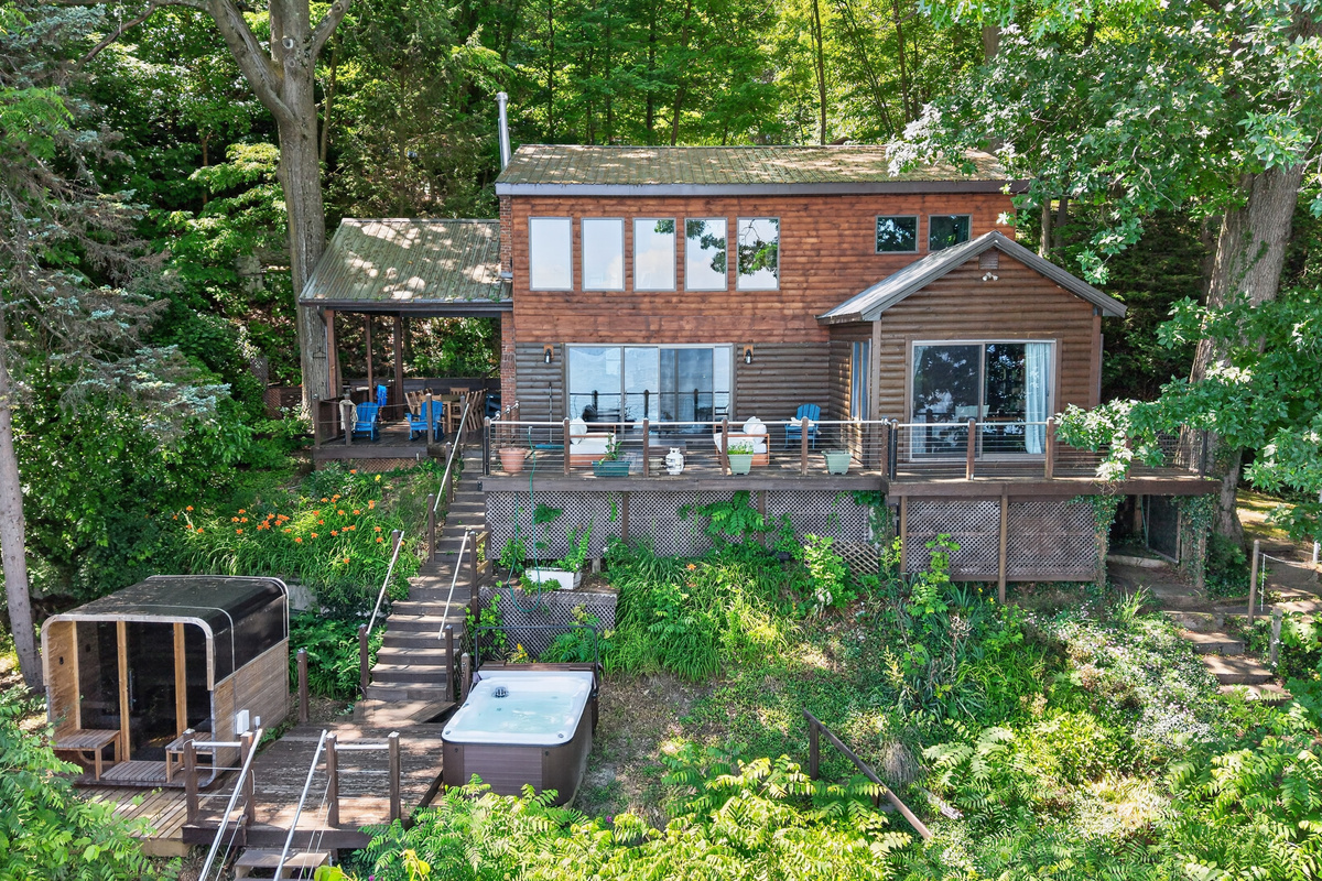 Hot tub positioned below the back deck