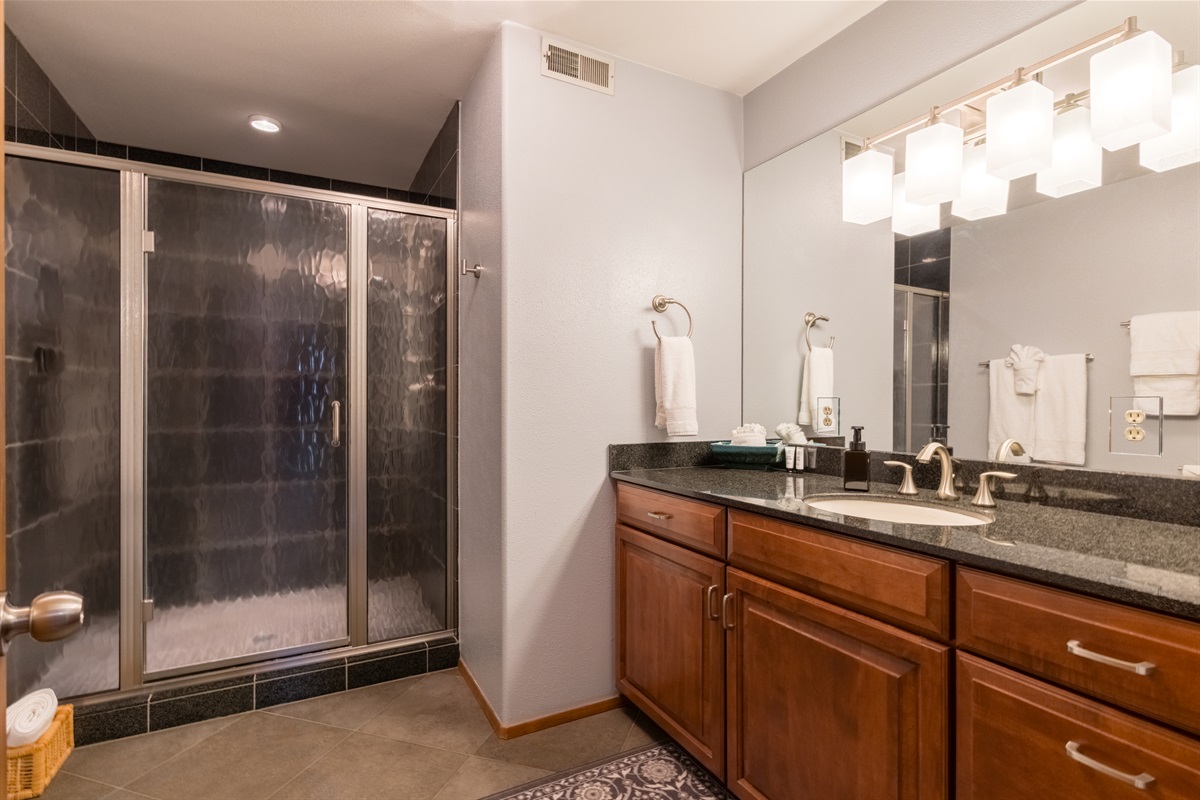 Upstairs bathroom with spacious walk-in shower.
