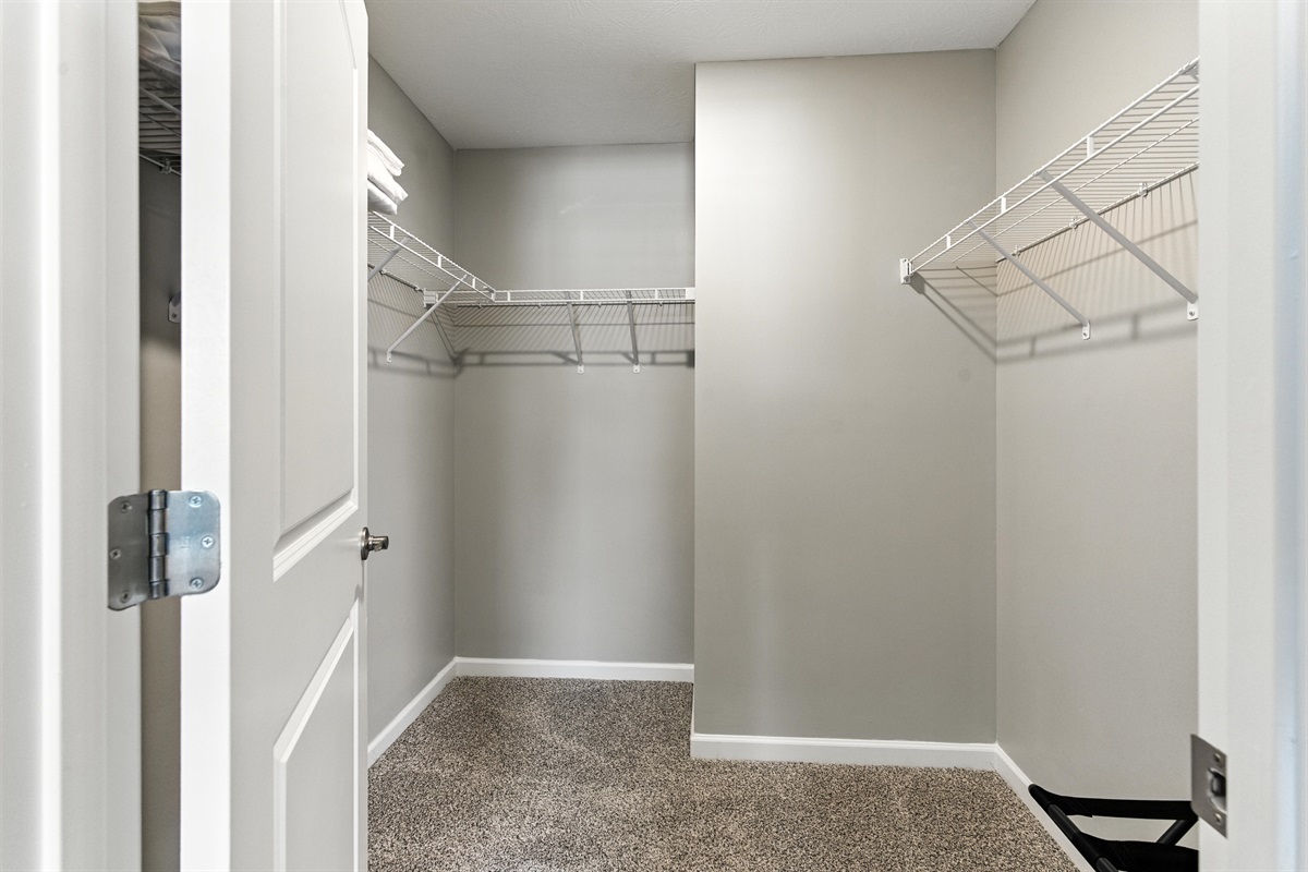 Master bedroom with ample storage and walk in closet
