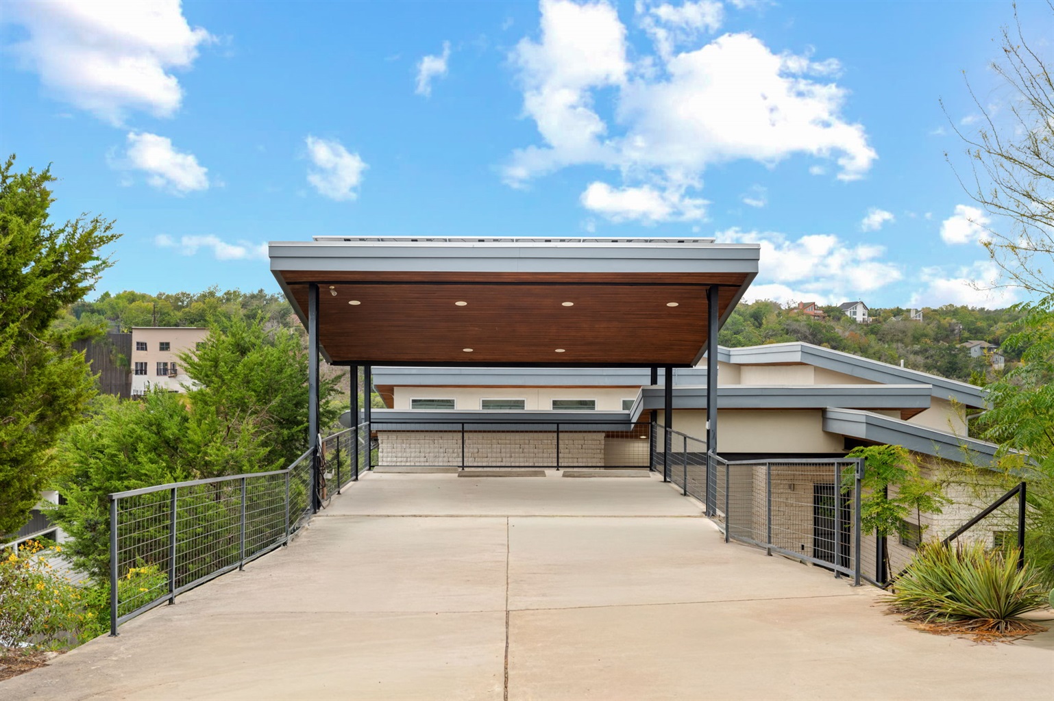 Private driveway and covered entry with modern design