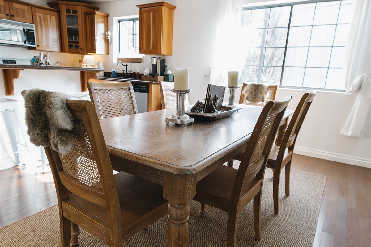 Inviting dining space with seating for the whole group—perfect for shared meals, game nights, and slow mornings together in the White Mountains.