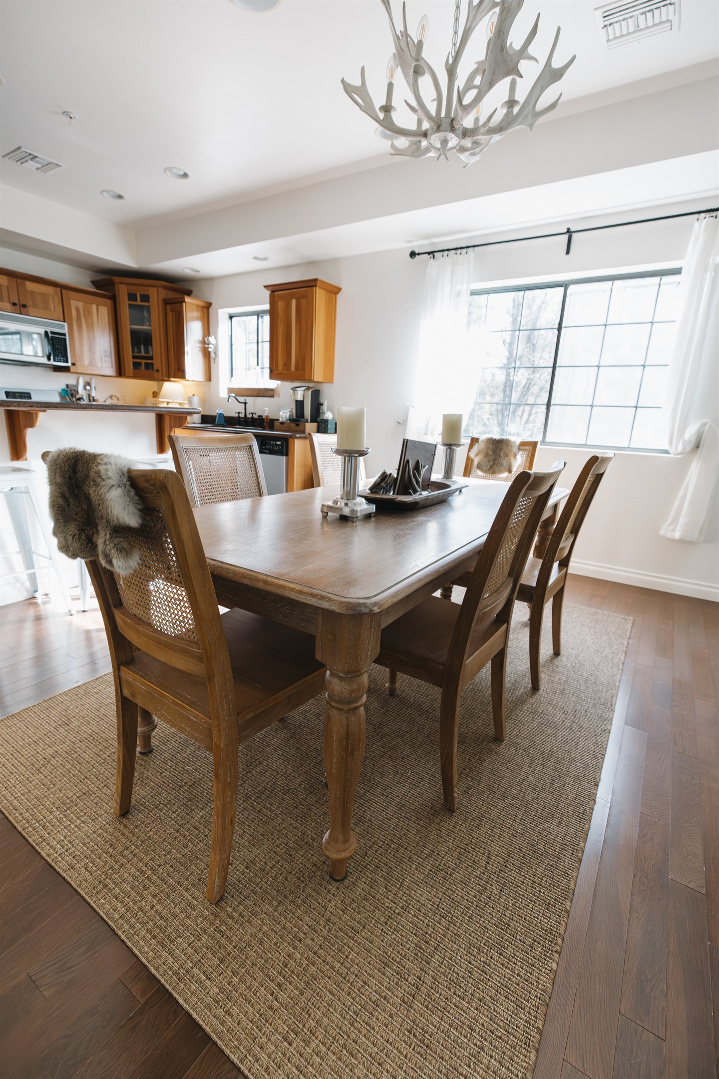 Inviting dining space with seating for the whole group—perfect for shared meals, game nights, and slow mornings together in the White Mountains.