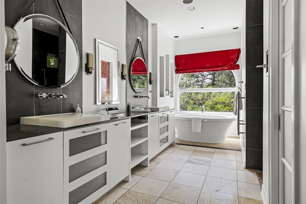 Primary bathroom has a jacuzzi tub, walk-in shower, dual sinks and towel warmer.