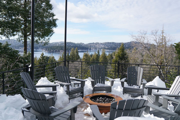 Stay warm by the fire, with snow and a view.