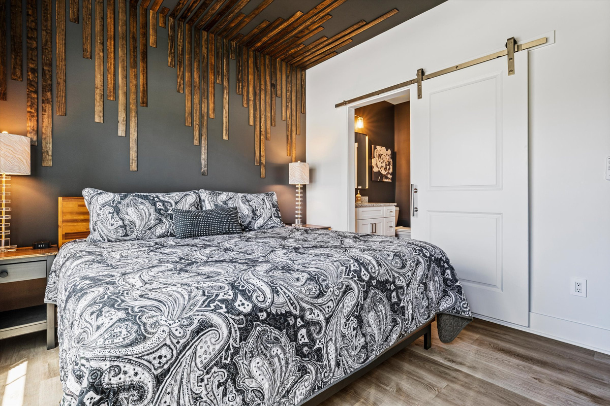 A king bedroom designed for comfort, quiet, and sleeping just a little later than usual.