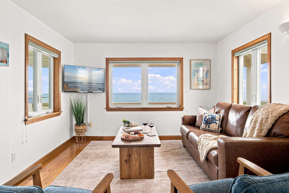 Gather in the cozy living room and enjoy beautiful coastal views.