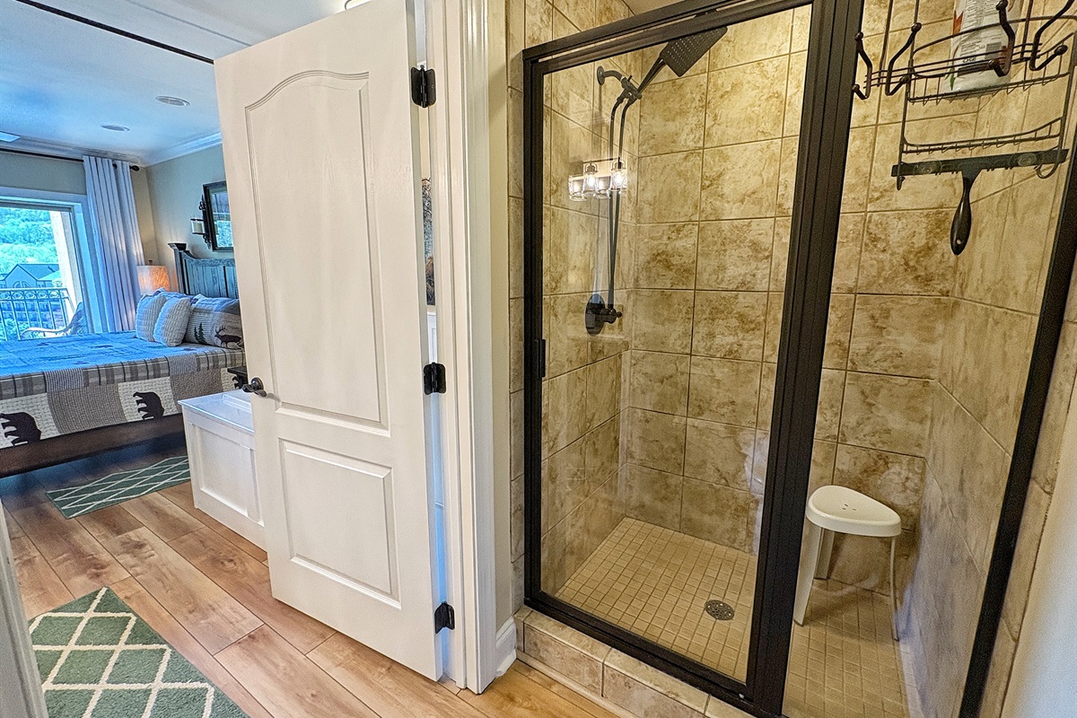 Primary bath walk in shower with rainfall head and handheld sprayer