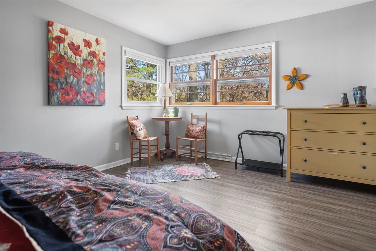 Spacious bedroom with small seating area