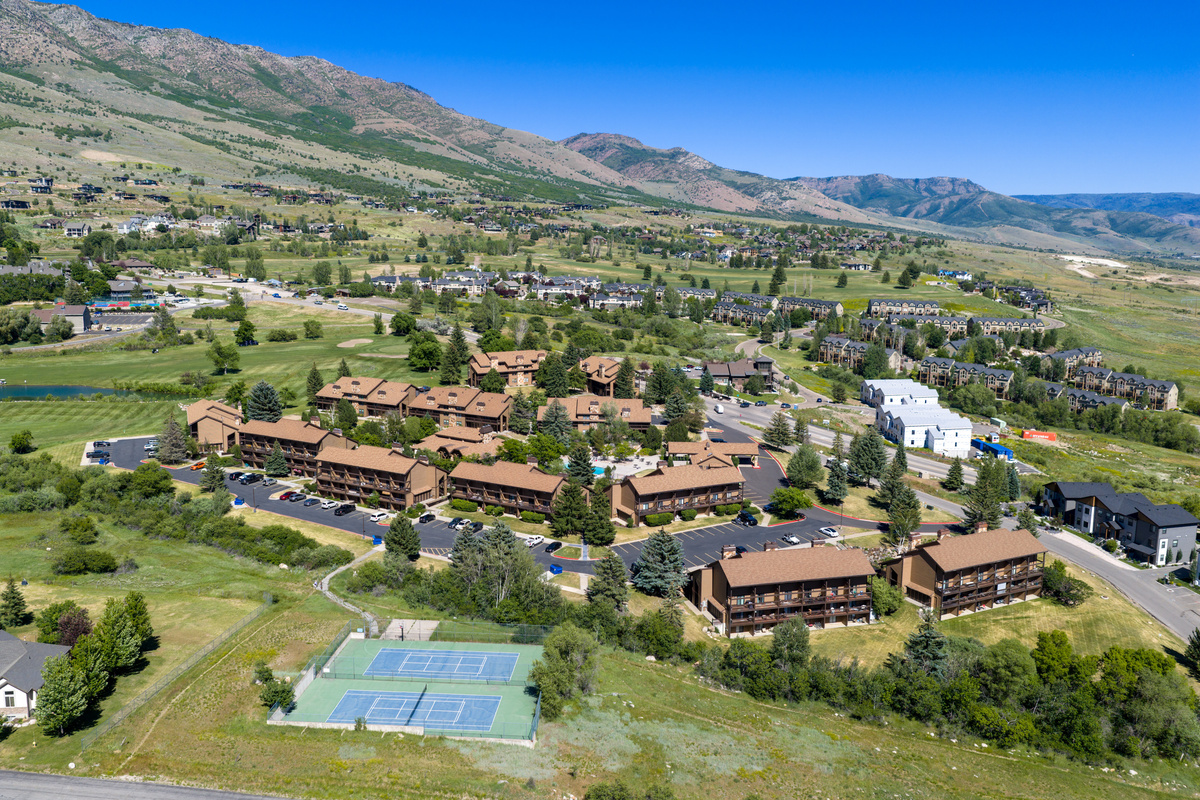 Aerial view of the Wolf Lodge community with nearby resort amenities and mountain views.