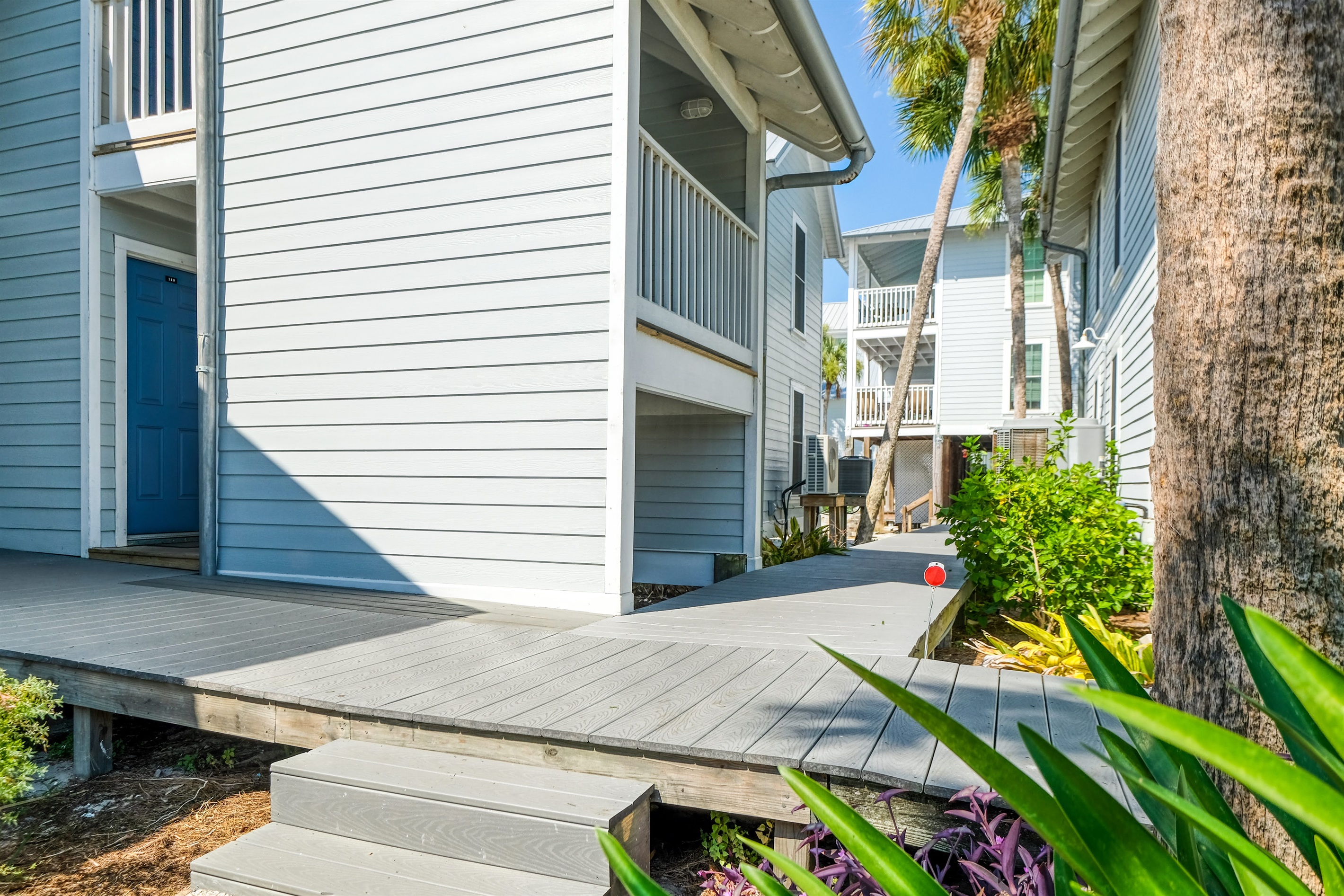 Well kept landscaping line the walk ways through out the complex