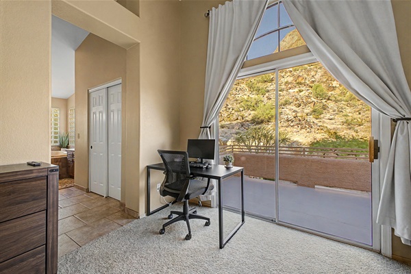 Primary Bedroom: Stunning views paired with a sleek workspace—your perfect retreat awaits!