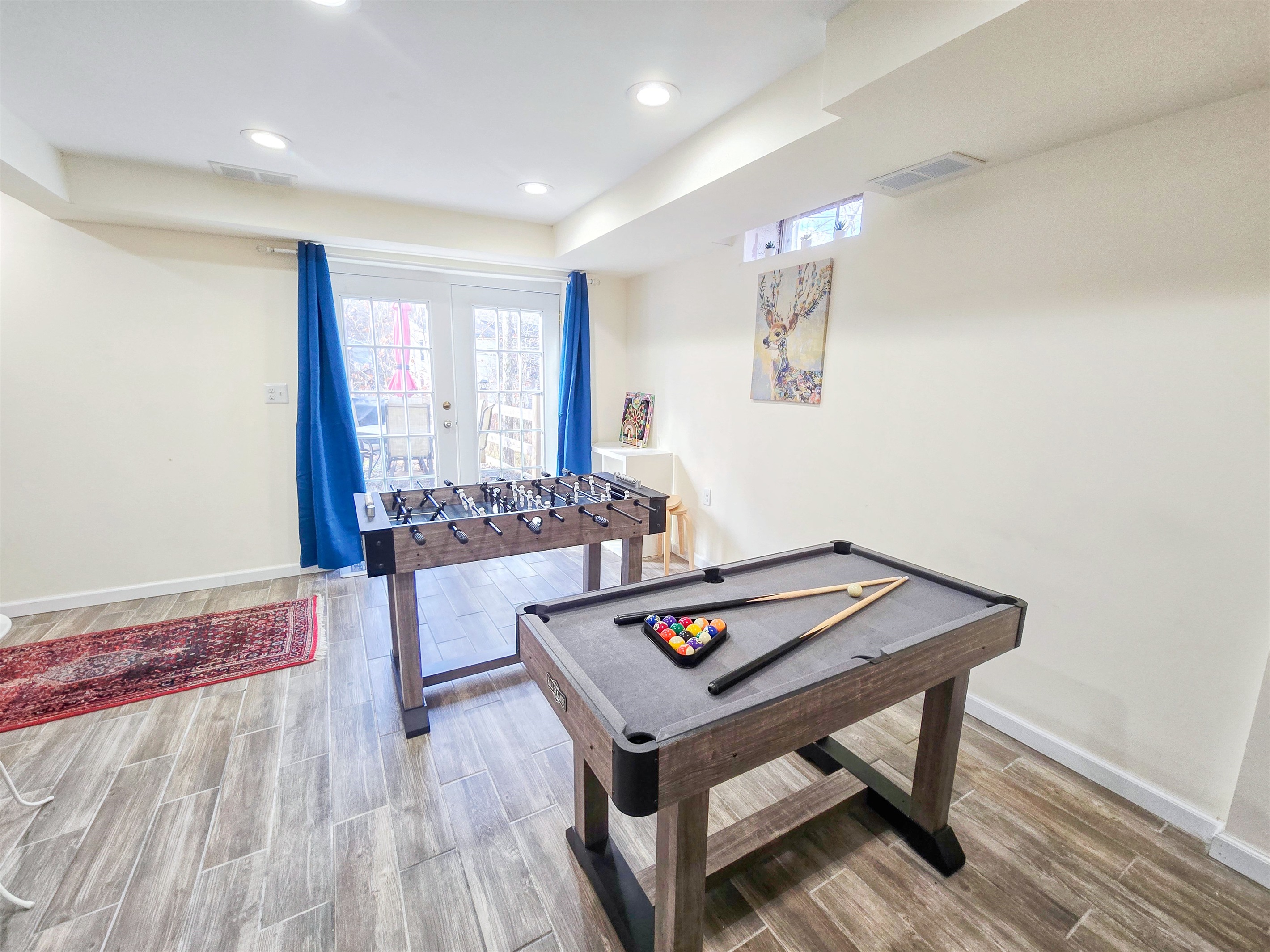 Lower level with Smart TV, PlayStation 5, foosball, mini pool table