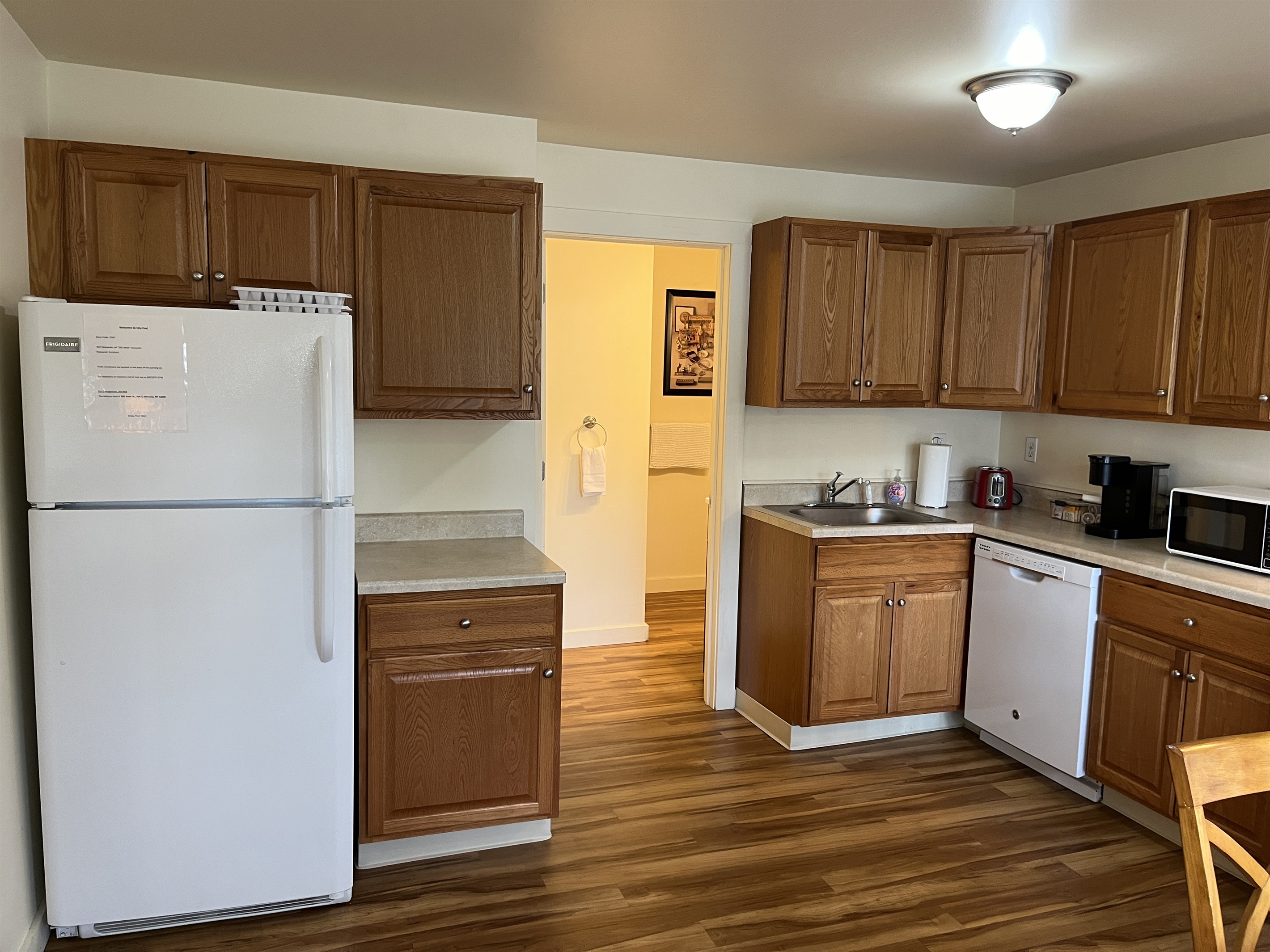 Eat-in kitchen with bathroom beyond