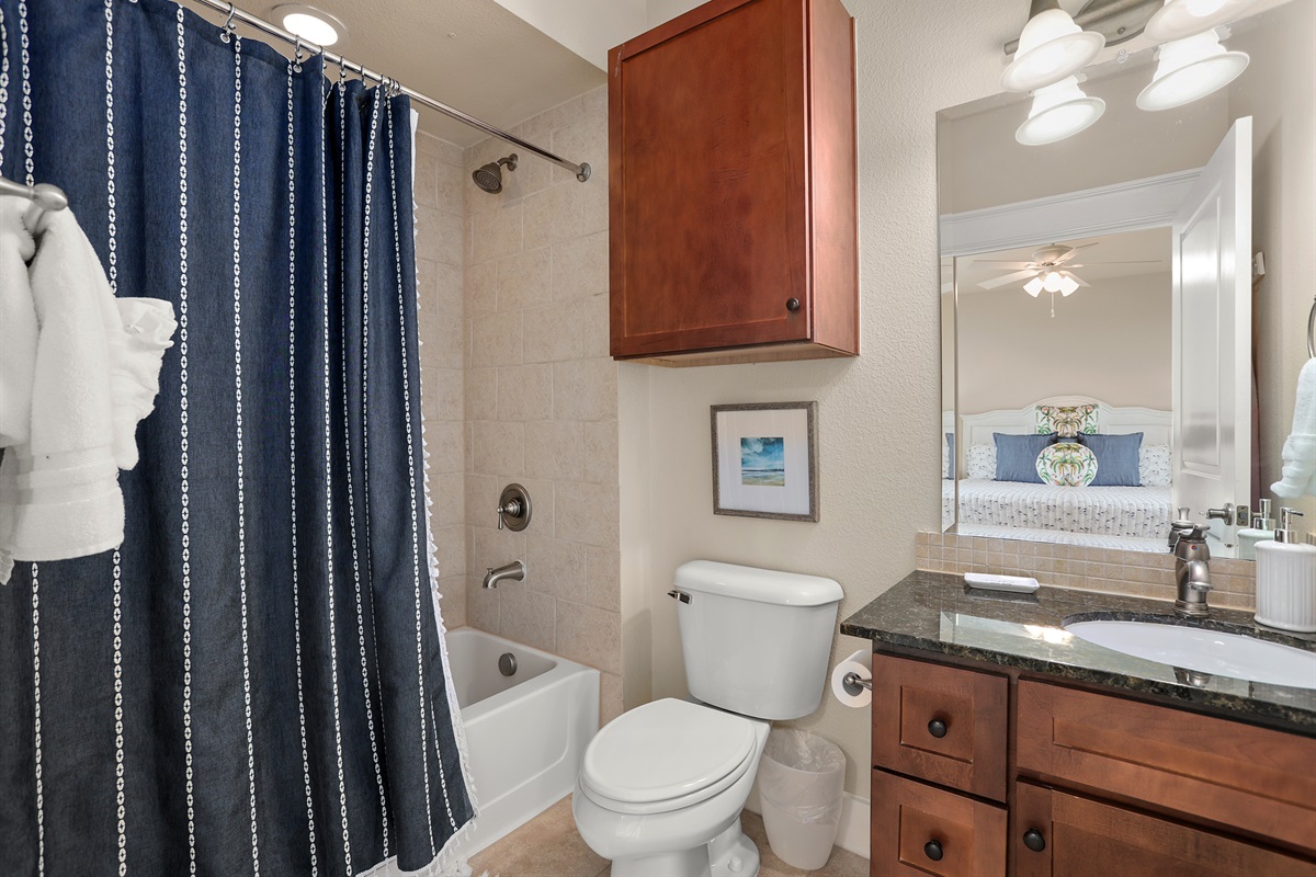 Ensuite bathroom with tub/shower combo.