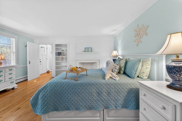 Spacious primary bedroom featuring a coastal décor, and plenty of room to unwind.