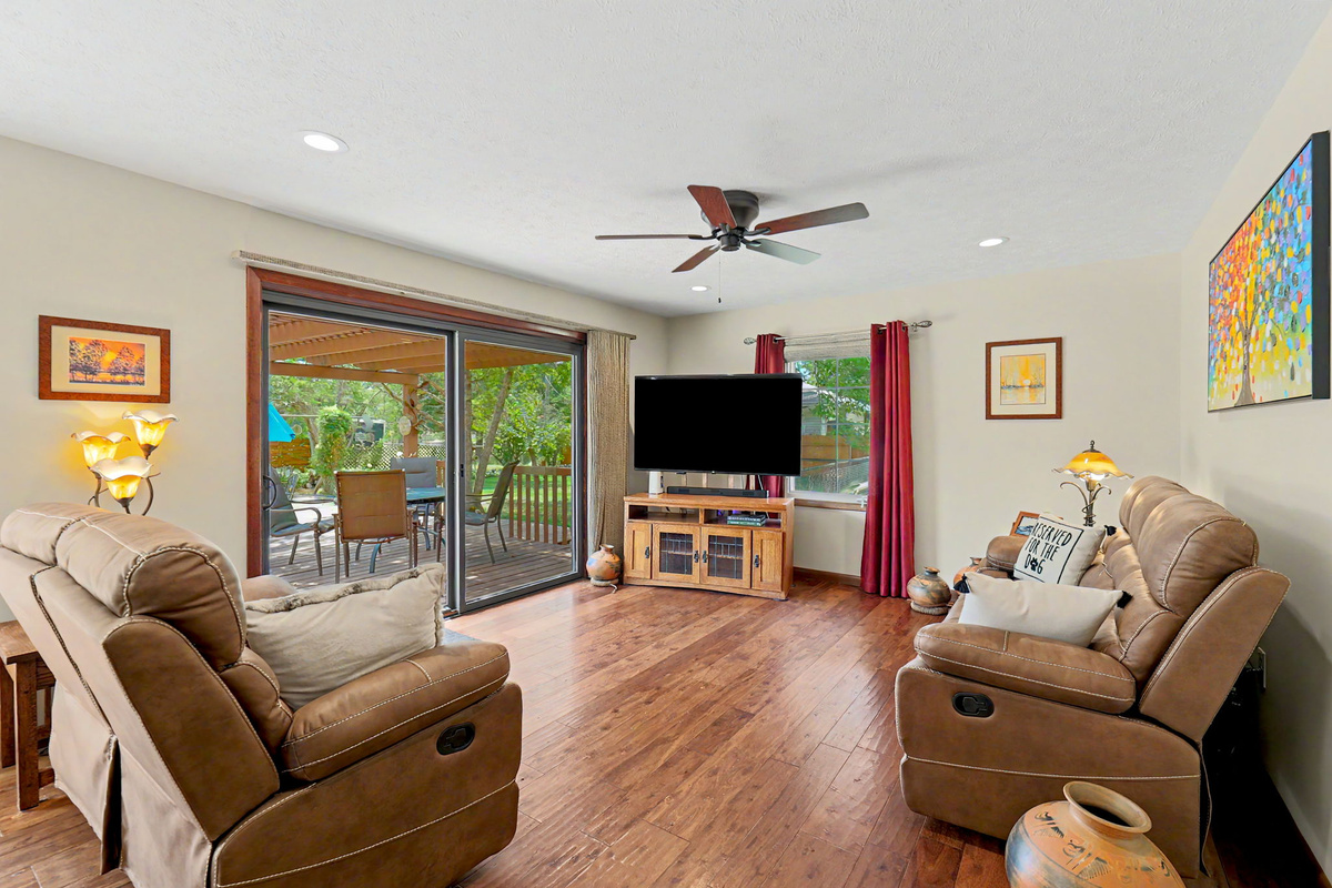 Spacious living room with patio door access to backyard