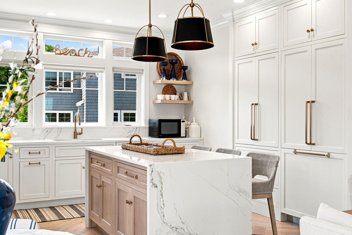 Clean coastal design meets everyday convenience in this spacious, light-filled kitchen.