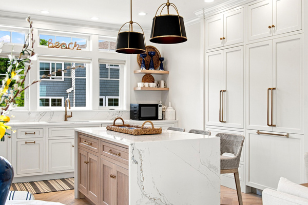 Clean coastal design meets everyday convenience in this spacious, light-filled kitchen.