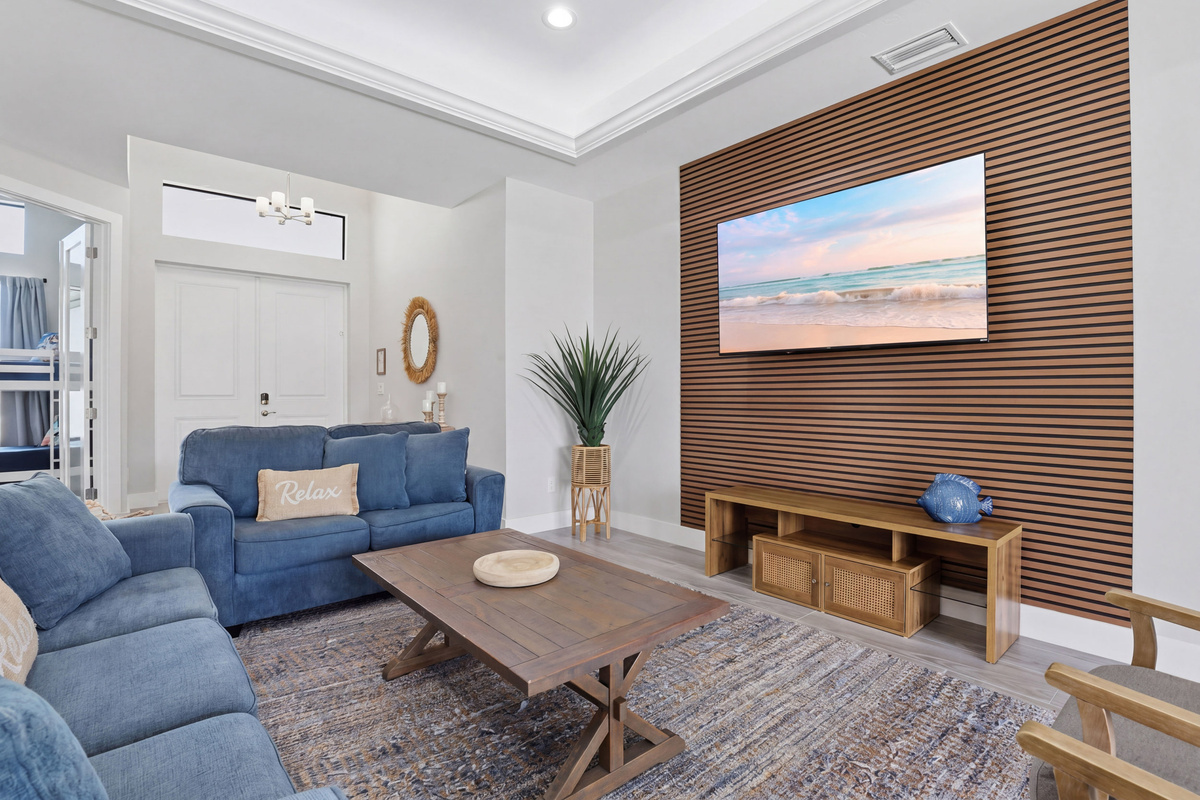 Large, open concept living area with flat screen TV